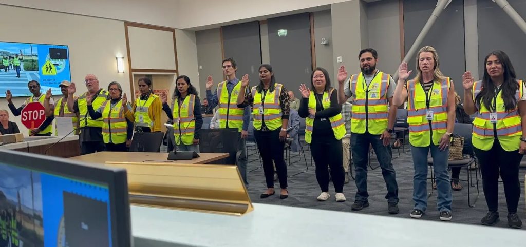 Volunteers in safety vests at a community event