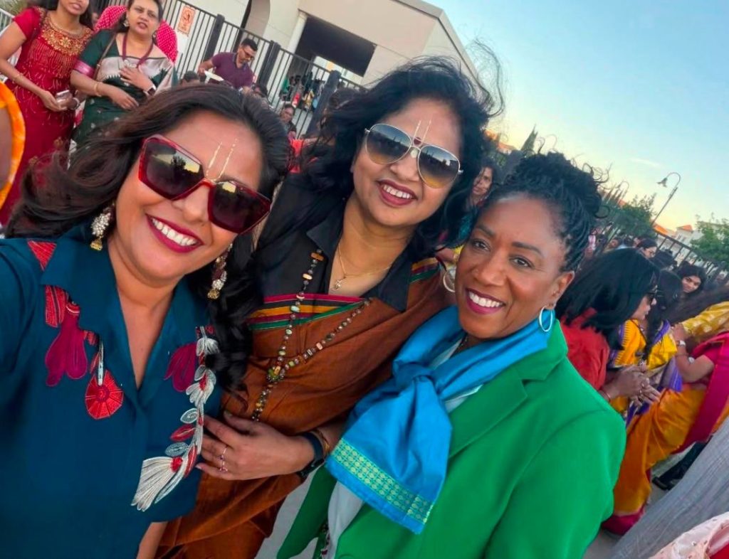 Ronna Green taking a selfie with friends at a cultural celebration