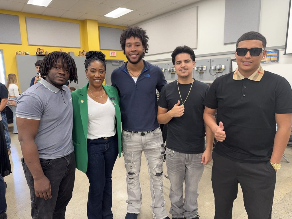Ronna Green with a group of young people at a community event