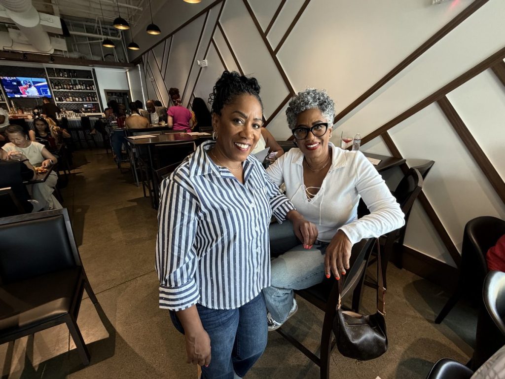 Ronna Green talking with a supporter at a campaign event