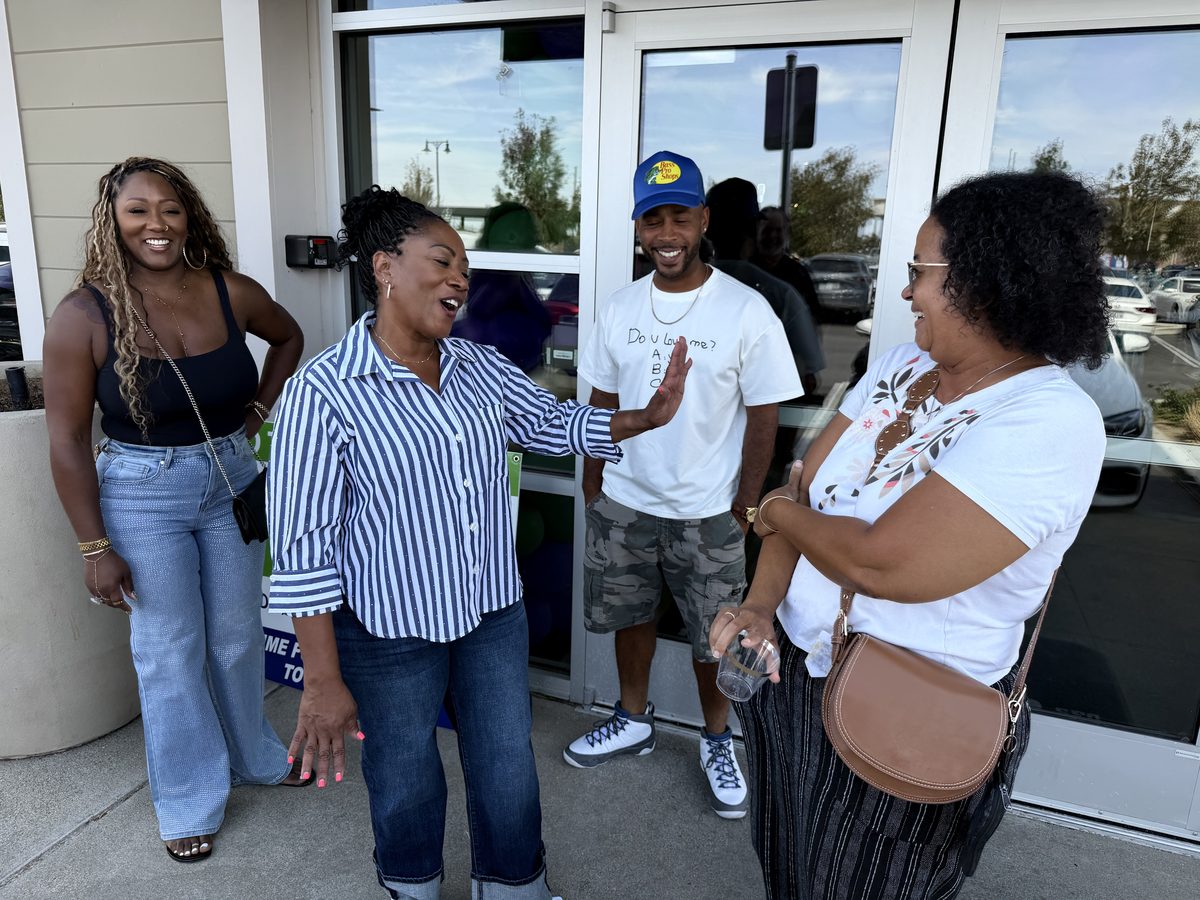 Ronna Green greeting attendees outside a campaign event