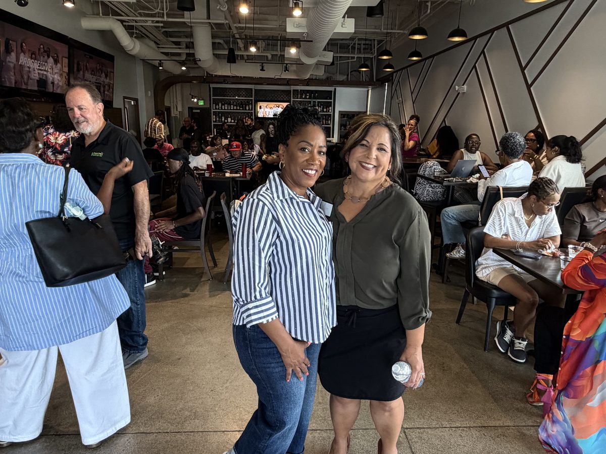 Ronna Green with an attendee at a campaign event