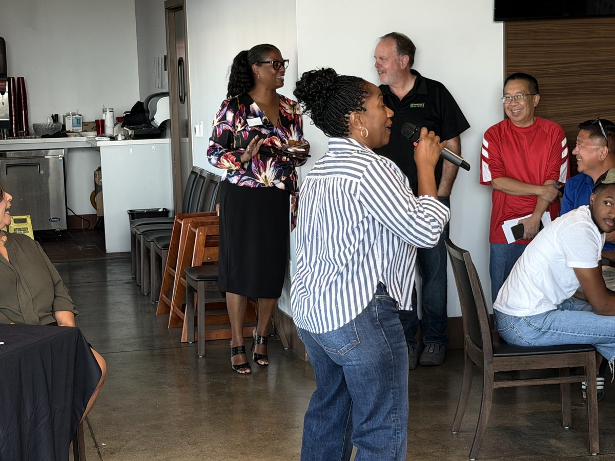 Ronna Green talking with attendees at a campaign event