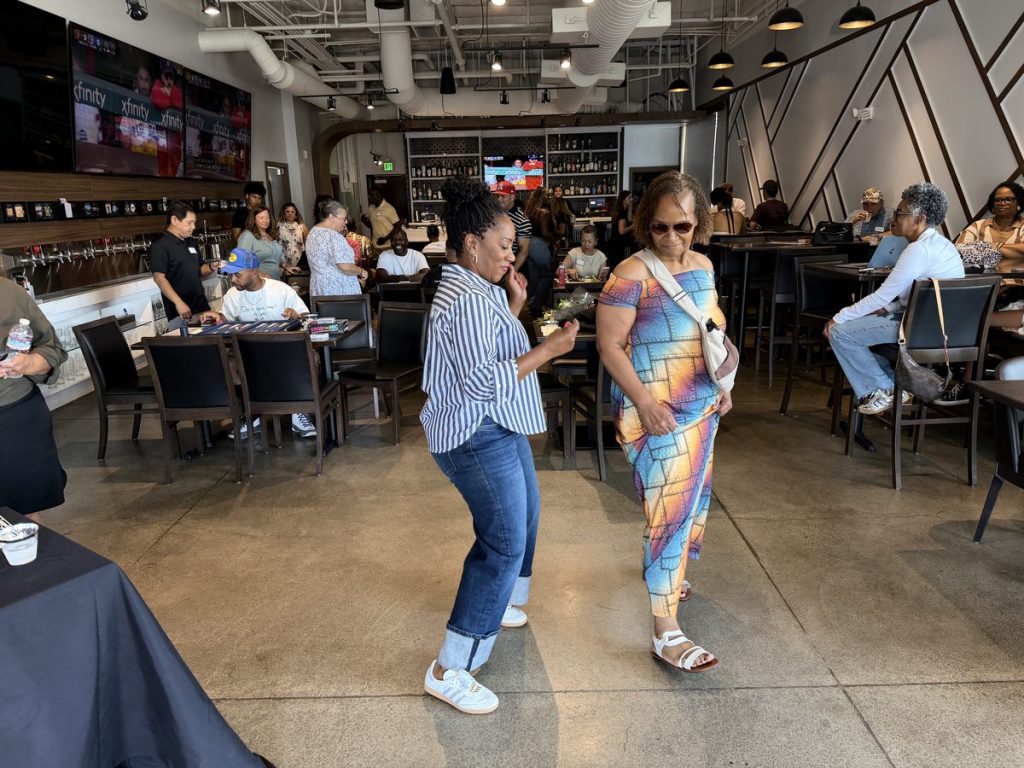 Ronna Green greeting an attendee at a campaign event