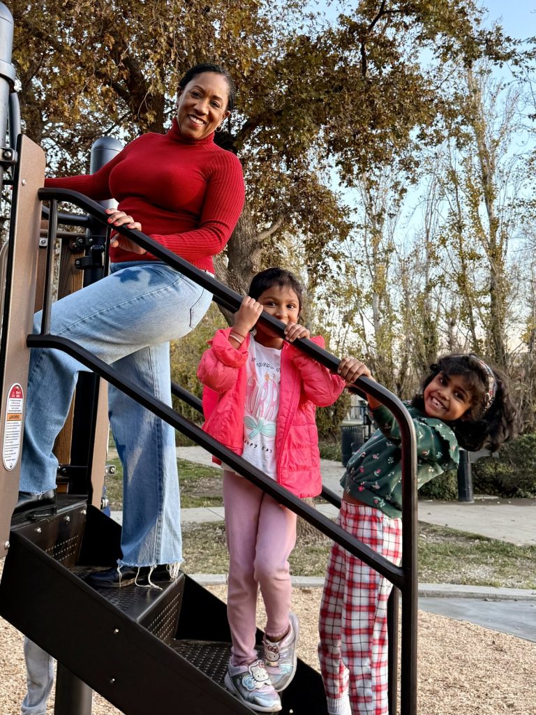 Ronna Green with children on playground equipment at a Mountain House park