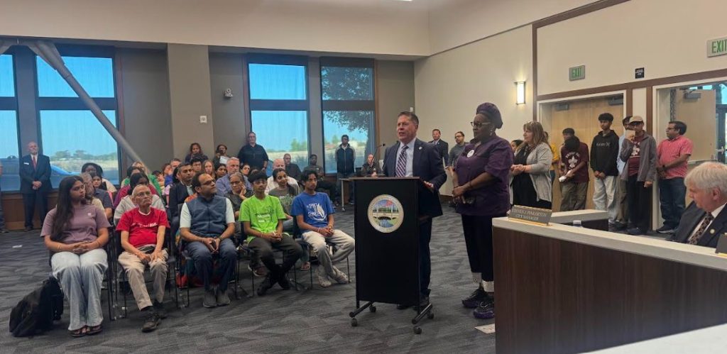 Residents at a fentanyl awareness meeting in a council chamber