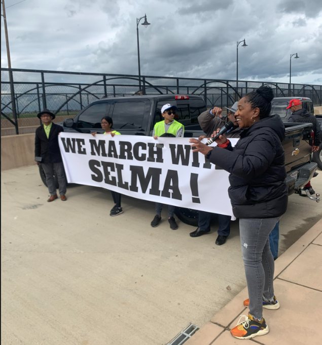 Marchers holding a banner reading "We march with Selma!"